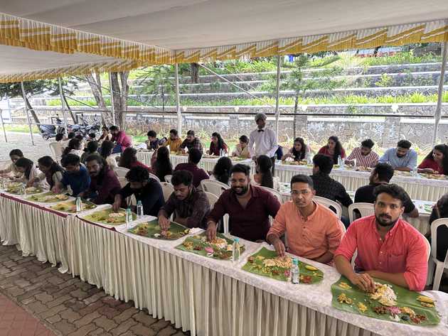 Edstem Technologies employees enjoying traditional Onam Sadhya feast and authentic Kerala cuisine at company celebration